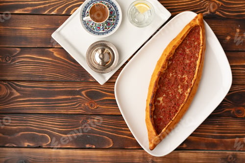 Preview: Pide - Turkish baked bread on wooden table