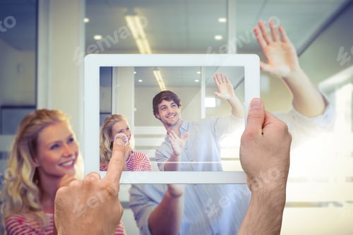 Preview: Hand Holding Tablet Pc Against Colleagues Envisioning An Idea Together