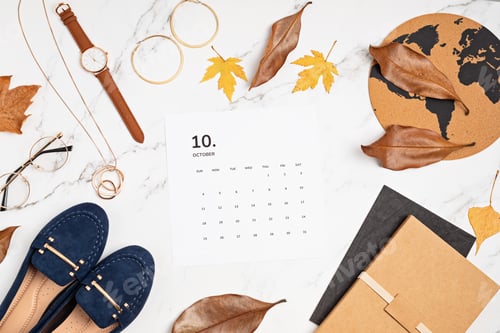 Preview: Flat lay with calendar for october with woman fashion fall accessories.