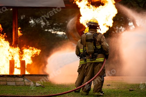 Preview: A group of firefighters uses high-pressure hoses to battle a massive blaze