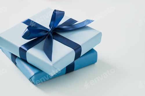 Preview: Blue gift boxes on blue background. Close up