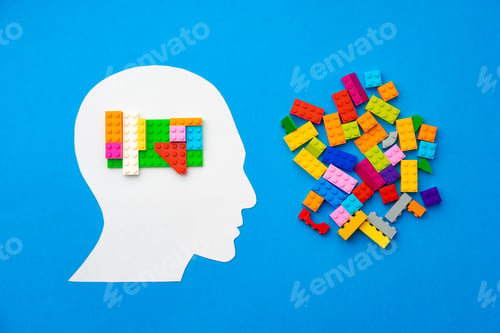 Preview: Papercut silhouette of human head with colorful constructor pieces