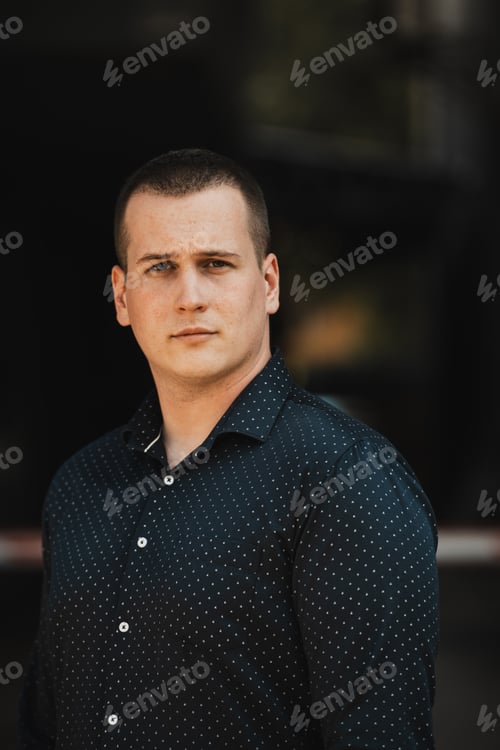 Preview: A portrait of a modern man, exuding confidence and style, against an outdoor backdrop, showcasing