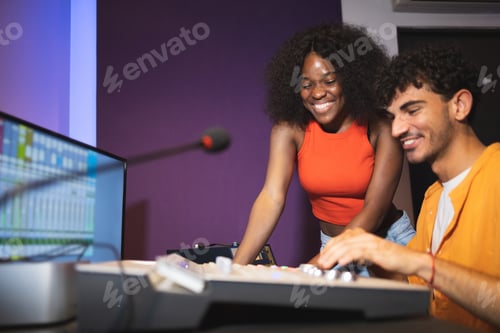 Preview: Man and black woman adjusting recorded sound