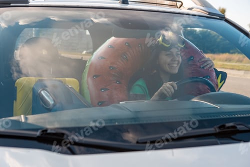 Preview: sea car travel trip smiling woman driver in car full of vacation stuff