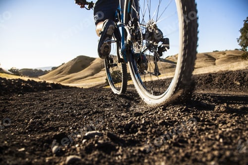 Preview: Cropped surface view of young man mountain biking on dirt track, Mount Diablo, Bay Area, California,