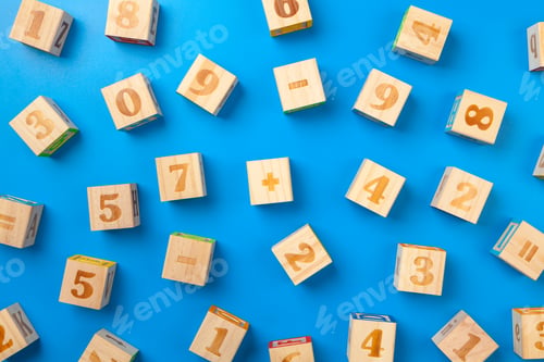 Preview: Numbers. Wooden colorful alphabet blocks on blue background, flat lay, top view
