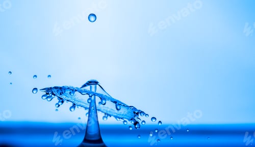 Preview: Water drop splashing into blue water surface