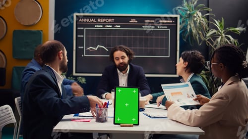 Preview: Chief information officer attends meeting with staff next to isolated screen