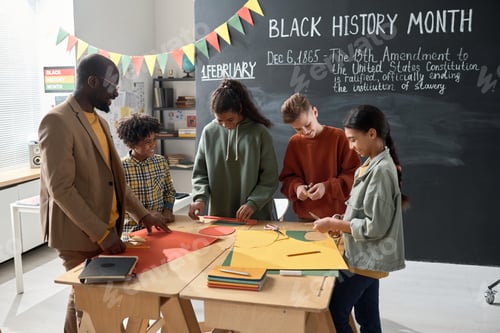 Preview: Children with teacher preparing for Black History Month