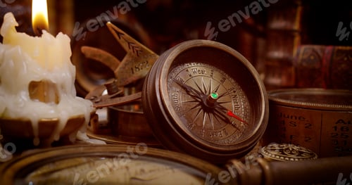 Preview: Vintage style travel and adventure. Vintage old compass and other vintage items on the table.