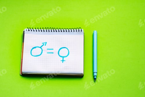 Preview: Children's drawing in a notebook with the symbol of women and men and an equal sign.