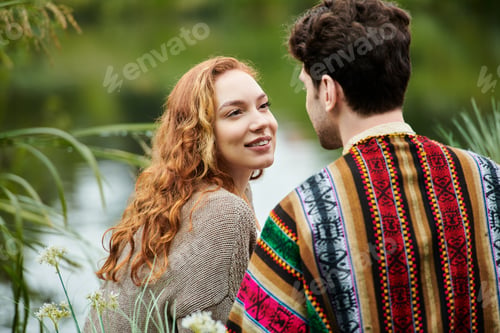 Preview: Bohemian lovebirds embracing in nature