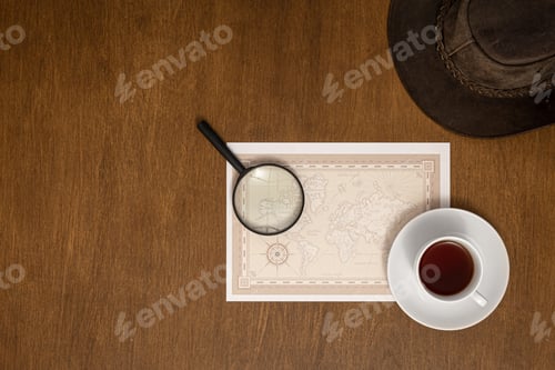 Preview: World map, magnifier and coffee on a wooden background, flat lay.