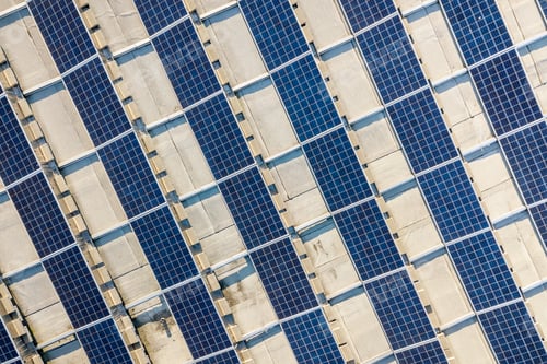 Preview: Top view of blue shiny solar photo voltaic panels system producing renewable clean energy