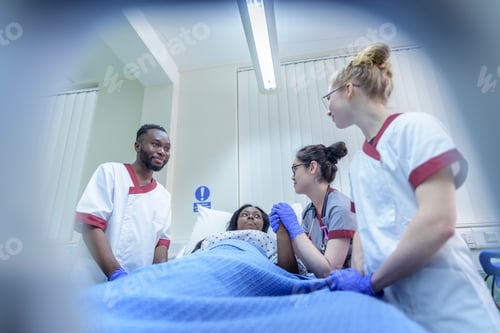 Preview: Nurses with patient on hospital ward
