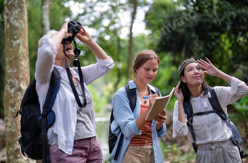 Preview: Backpack tourist travel outdoor adventure bird study using binoculars looking and record to book
