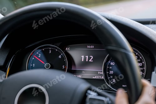 Preview: Steering wheel in a car close up, high speed driving on the road.