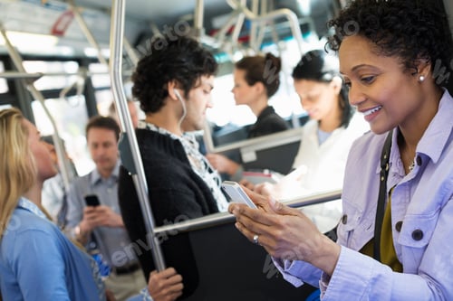 Preview: People,men and women on a city bus,woman on her phone