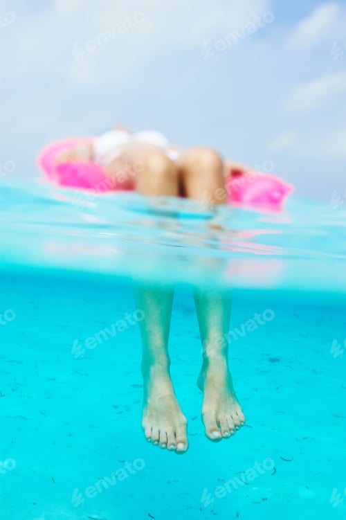 Preview: Woman Relaxing On Inflatable Mattress At The Beach, View From Underwater