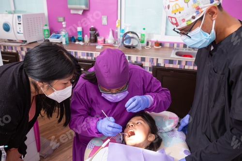 Preview: Mexican female dentist explaining the dental problems the young girl has to her mother