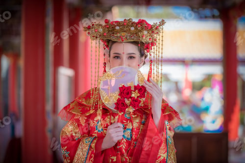 Preview: Portrait happiness young beautiful Asian woman wear red cheongsam dress costume posing happy smiling