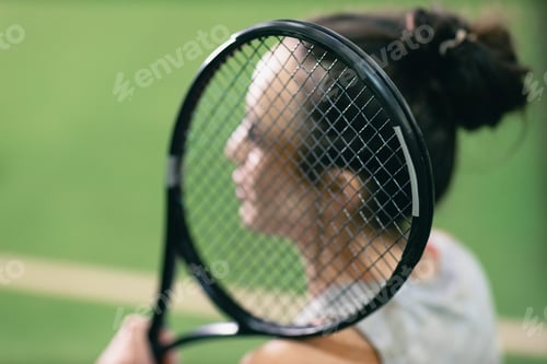 Preview: Tennis woman player portrait with racket and ball at court.