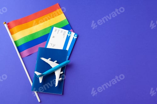 Preview: The concept of travel for gays and lesbians. Passport, toy plane and gay flag