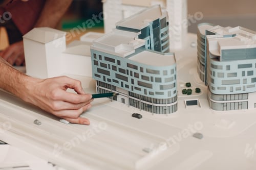 Preview: Architect with blueprints and layout design project at office
