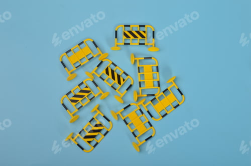 Preview: Construction fences isolated on a blue background.