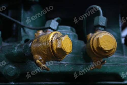 Preview: Large Yellow Bolts On Pipes