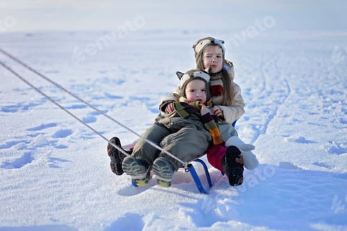 Preview: Happy family having fun at winter walk outdoors