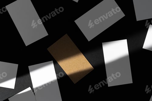 Preview: Blank businesscards on black background. Creative photo with shadows