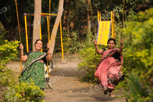 Preview: Indian woman enjoying in the public park