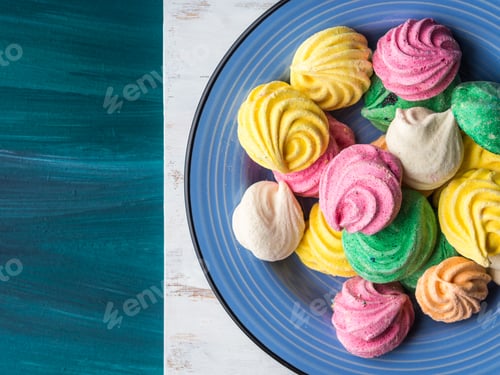 Preview: Colorful meringue on blue ceramic plate