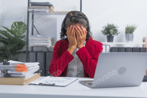 Preview: Confident Asian elderly old businesswoman tired stressed suffering from headache at work with laptop