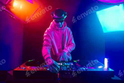 Preview: Male DJ playing music in the night club