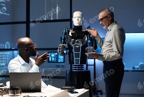 Preview: Engineers discussing designing of robot in team