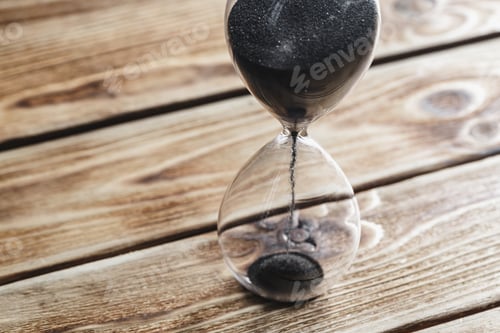 Preview: Modern hourglass on wooden background