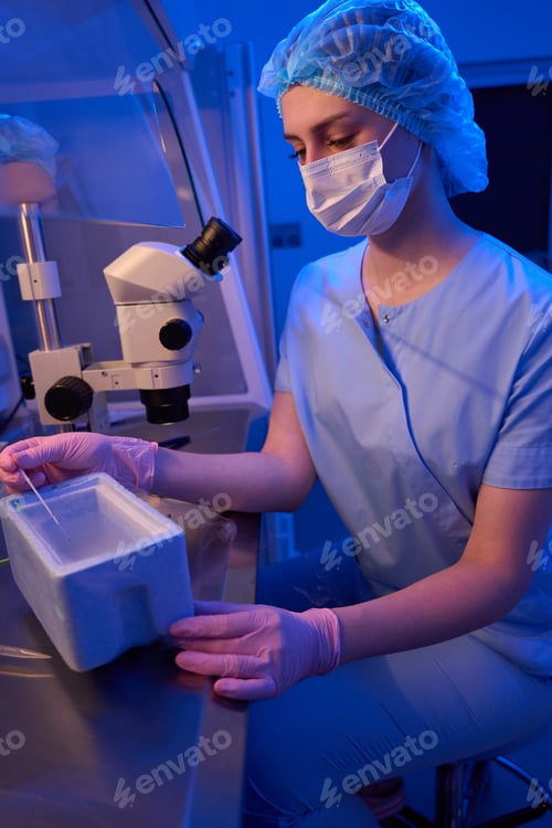 Preview: Lab scientist performing reproductive cell freezing procedure in liquid nitrogen