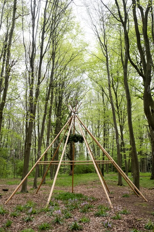 Preview: Wooden structure with wreath for a woodland naming ceremony.