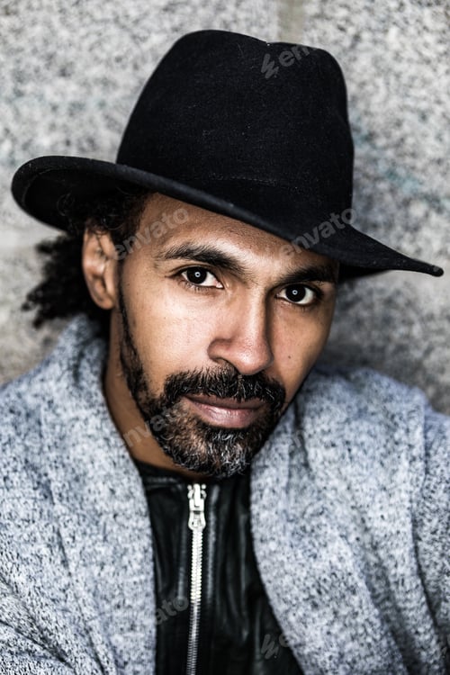 Preview: Bearded Hispanic man looking at camera