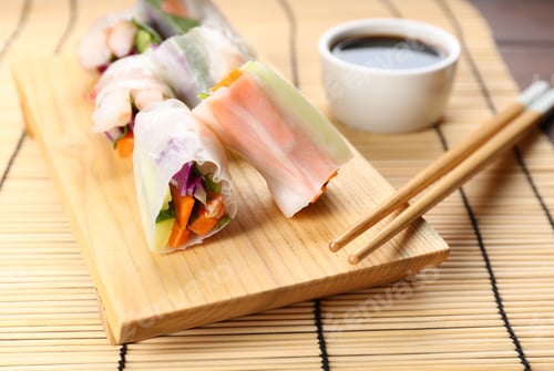 Preview: Delicious rolls wrapped in rice paper served on table