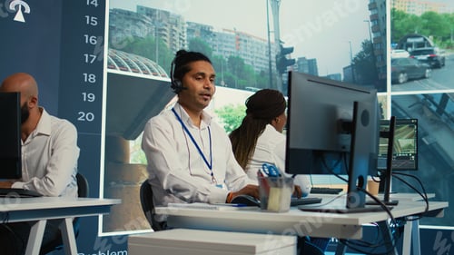 Preview: Indian employee communicating satellite map directions in observation room