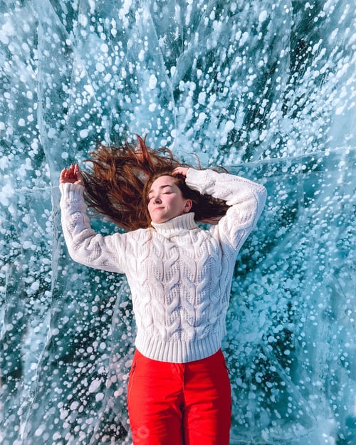 Preview: Woman lies on a Baikal ice