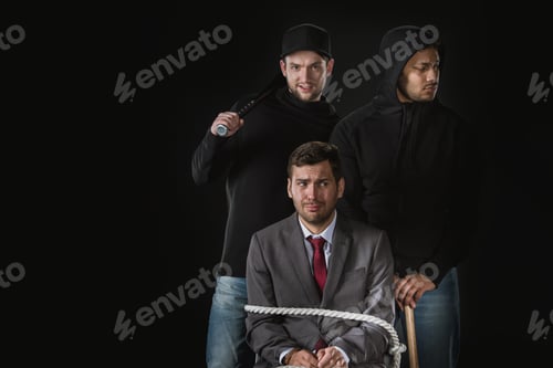Preview: young businessman kidnapped by two robbers in black zoodies