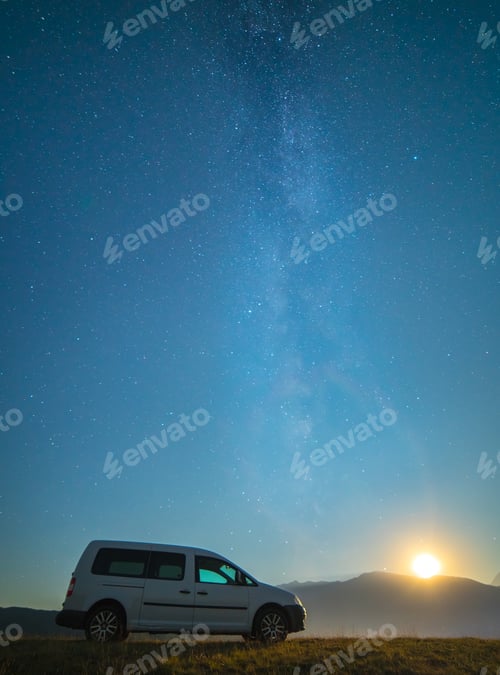 Preview: The car on the background of the milky way. night time.