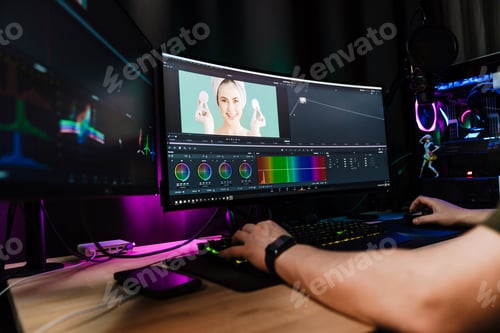 Preview: Back view of a young white man video editor