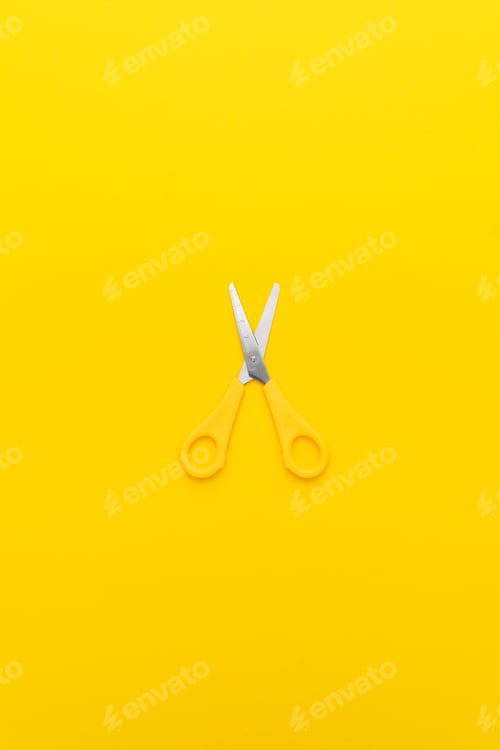 Preview: Flat Lay Vertical Shot Of Opened Yellow Scissors With Central Composition