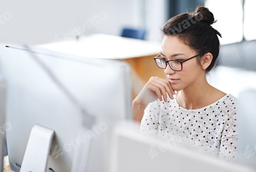 Preview: Make creativity a job. Shot of a young office worker sitting at her workstation in an office.